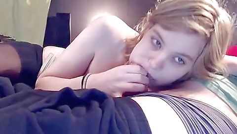 Hot babe with a sexy white dress sucking a dick from behind