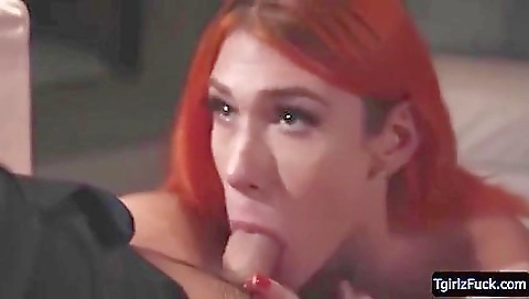 A hot redhead is getting fucked from behind in her ass